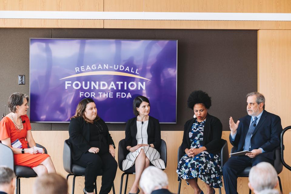 Mark Raza, JD, takes part in a panel discussion